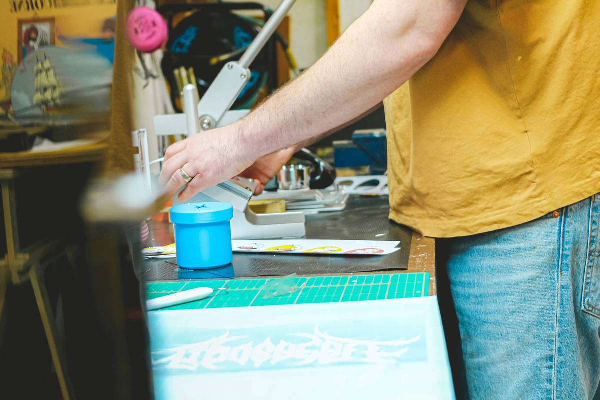 diy screen printing washout booth with blacked-out lighting and low-pressure spray nozzle over a stainless steel sink